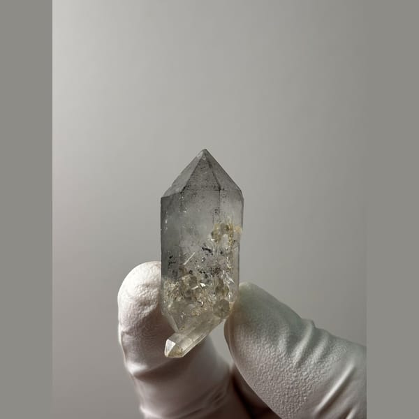 Clear double-terminated quartz with sketch-like markings from Yunnan — alternate view