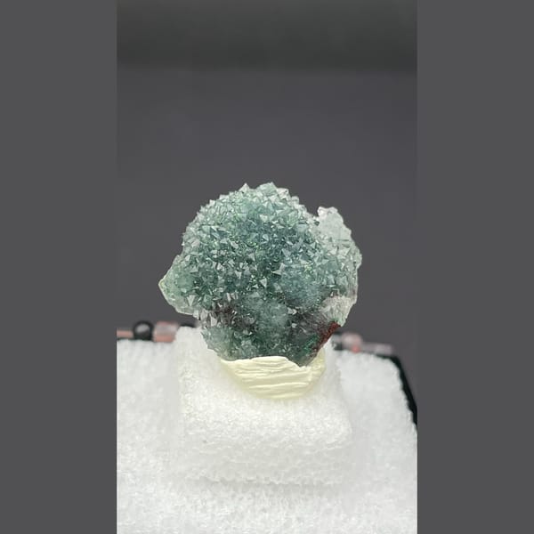 Small quartz cluster with green malachite inclusions from Congo — alternate view