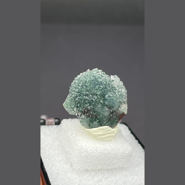 Small quartz cluster with green malachite inclusions from Congo — alternate view