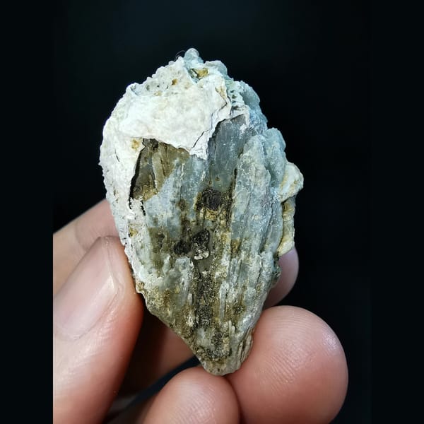 Etched grey-green quartz cluster with calcite — alternate view