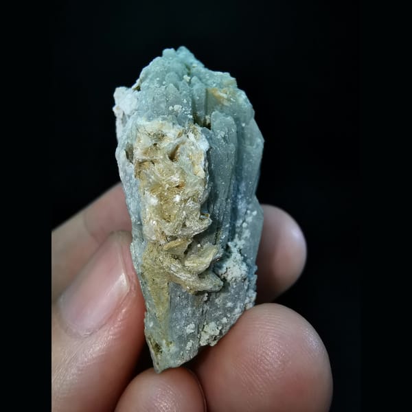 Etched grey-green quartz cluster with calcite — detail view