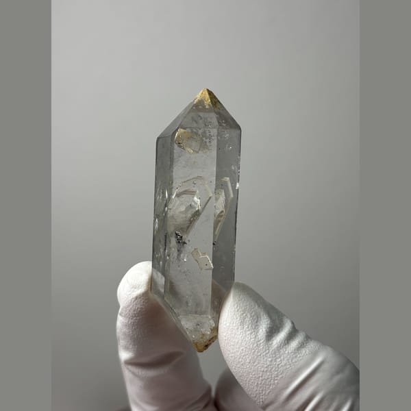 Clear double-terminated quartz with growth marks from Yunnan — complete view