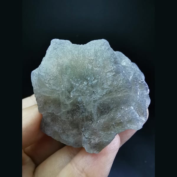 Pale green-grey cubic fluorite on candle quartz — complete front view