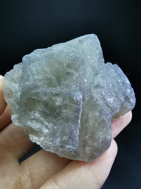 Cubic fluorite on candle quartz — complete oblique view of stepped faces