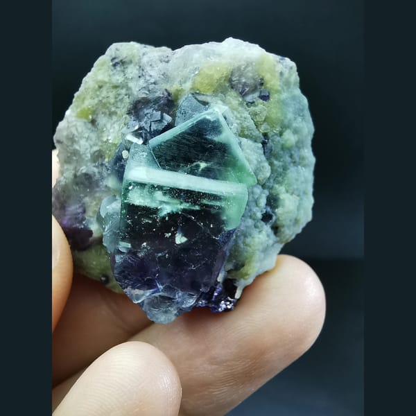 White-framed green-purple fluorite on mica — complete view