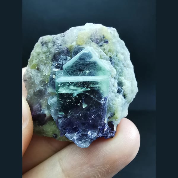 White-framed green-purple fluorite on mica — alternate view