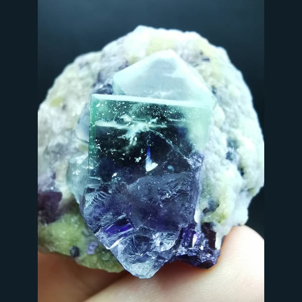 White-framed green-purple fluorite on mica — alternate view