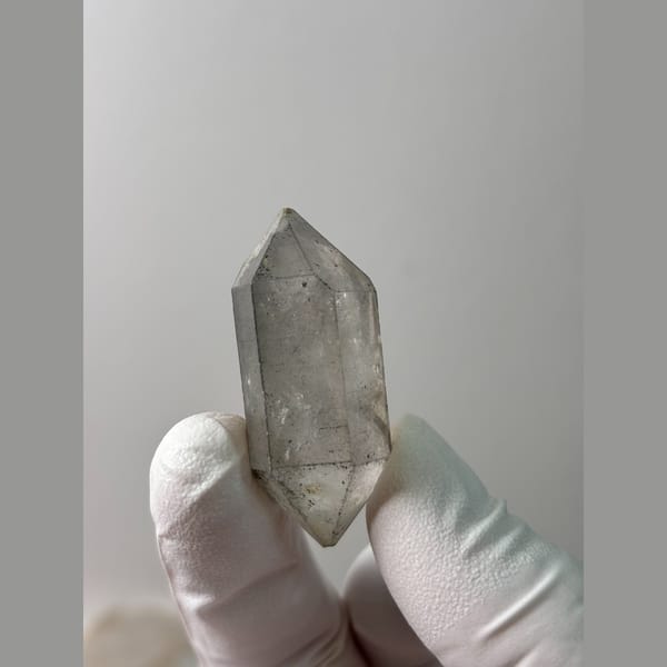 Clear quartz point with flower-like tip from Yunnan — complete view