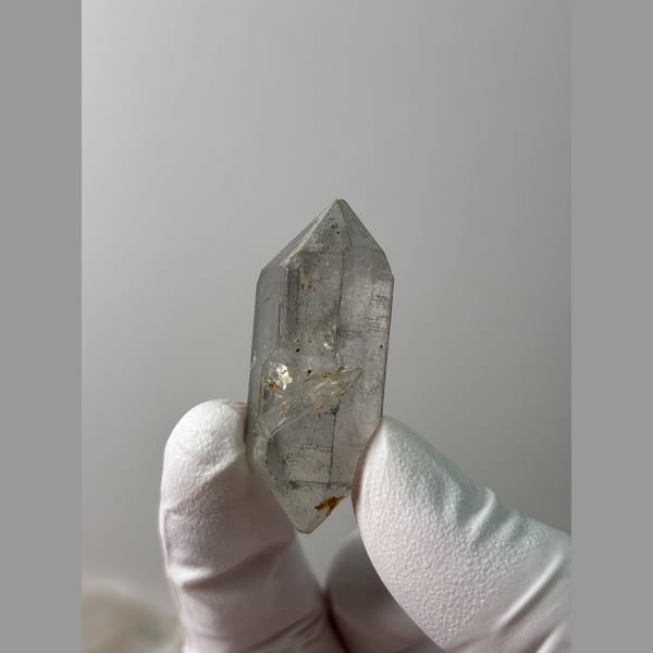 Clear quartz point with flower-like tip from Yunnan — alternate view