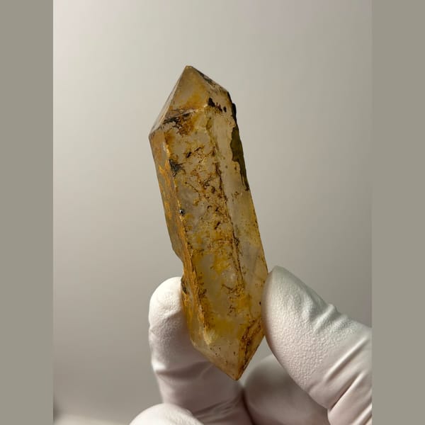 Long golden iron-stained quartz from Yunnan — complete view
