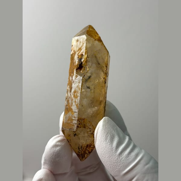 Long golden iron-stained quartz from Yunnan — alternate view