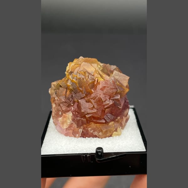 Amber brown fluorite cluster from Henan — complete view