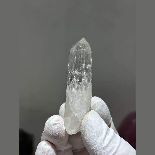 Slender clear quartz crystal from Xuebaoding, Sichuan — alternate view