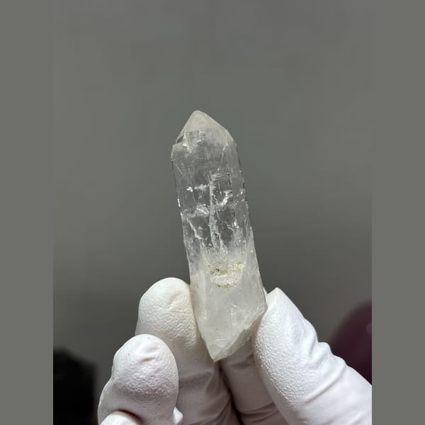 Slender clear quartz crystal from Xuebaoding, Sichuan — alternate view