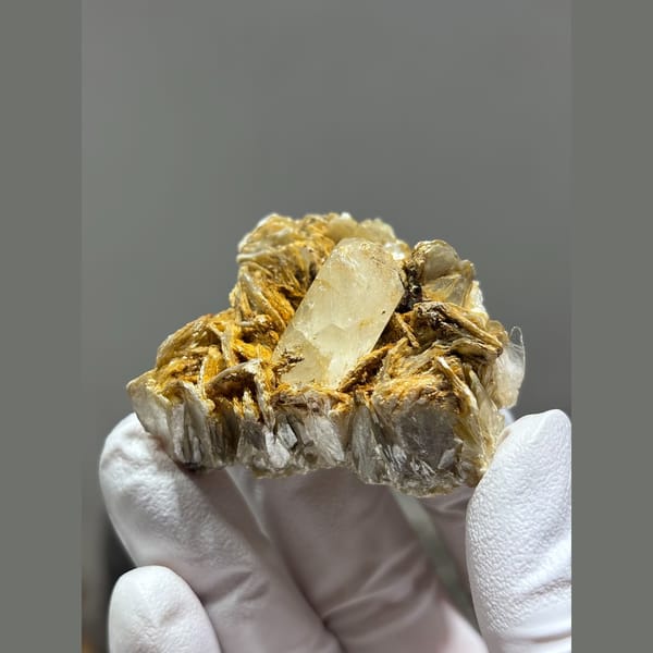 Aquamarine with golden mica sprays from Xuebaoding, Sichuan — detail view