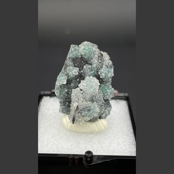 Small quartz cluster with green malachite inclusions from Congo — complete view