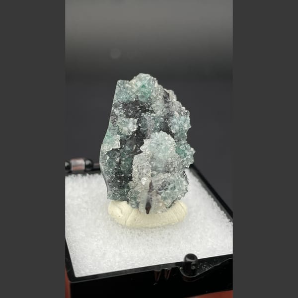 Small quartz cluster with green malachite inclusions from Congo — alternate view