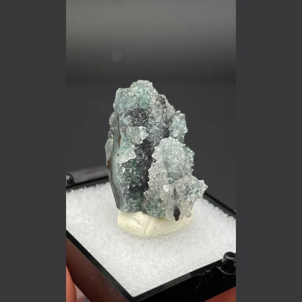Small quartz cluster with green malachite inclusions from Congo — alternate view