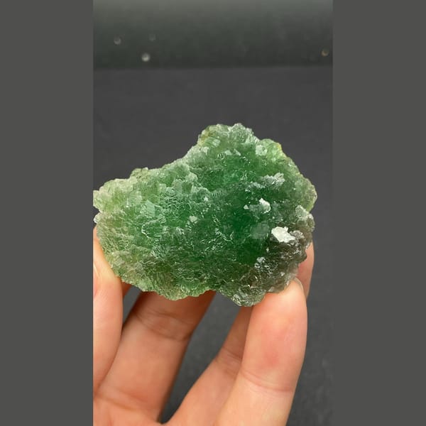 Vivid green stepped fluorite cluster from Henan — alternate view