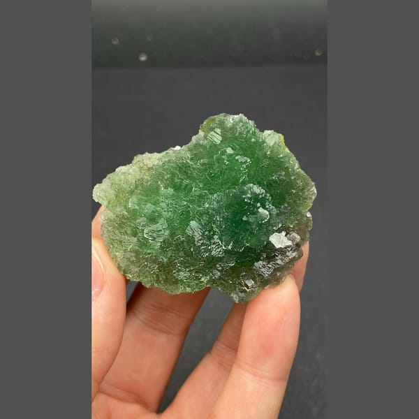 Vivid green stepped fluorite cluster from Henan — detail view