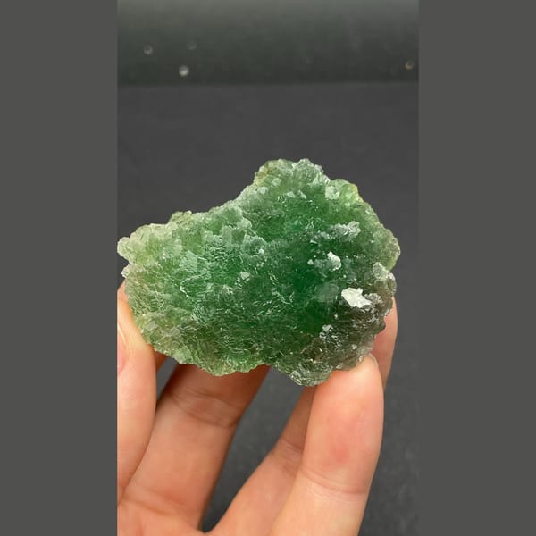 Vivid green stepped fluorite cluster from Henan — detail view