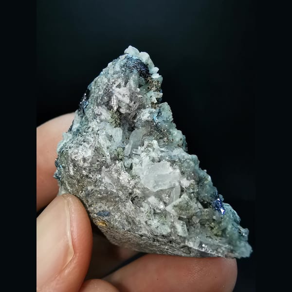Dolomite with specular hematite, goethite, quartz and calcite — detail view
