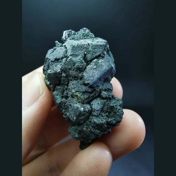 Lightly etched magnetite cluster — complete view