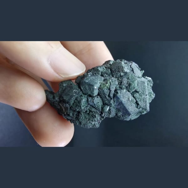 Lightly etched magnetite cluster — alternate view