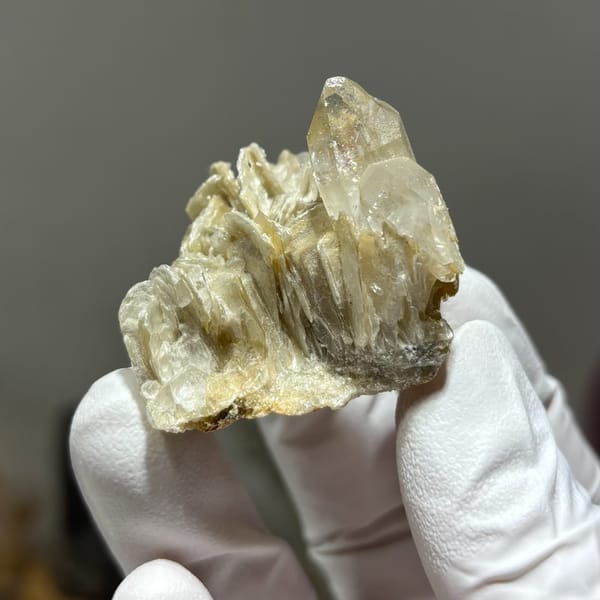 Compact tip-damaged Xuebaoding quartz — alternate view