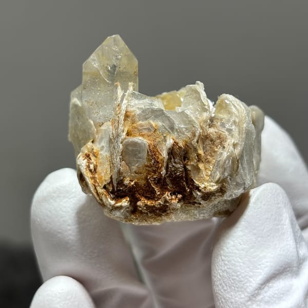 Compact tip-damaged Xuebaoding quartz — alternate view