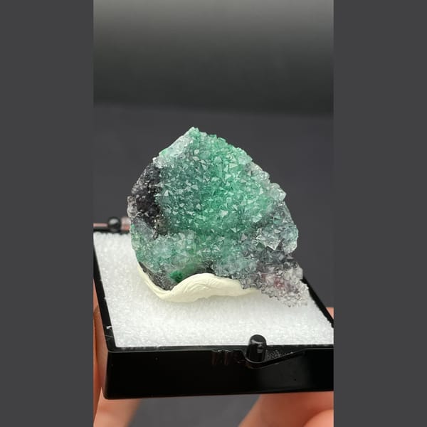 Small quartz cluster with green malachite inclusions from Congo — complete view
