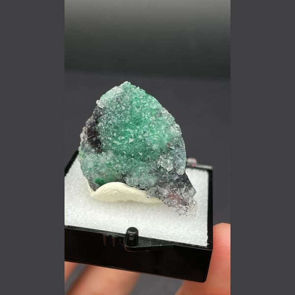 Small quartz cluster with green malachite inclusions from Congo — alternate view
