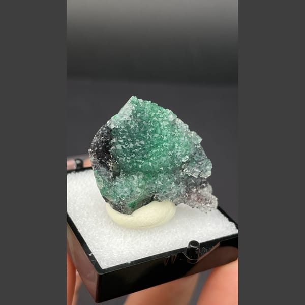 Small quartz cluster with green malachite inclusions from Congo — detail view