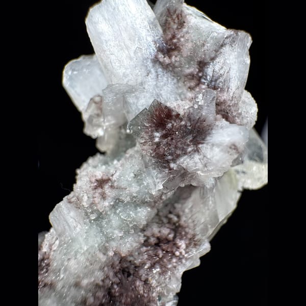 Apophyllite with Red Inclusions India 6.0 cm — detail view