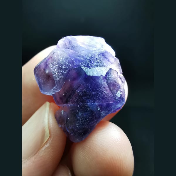 Small purple fluorite cluster — complete view