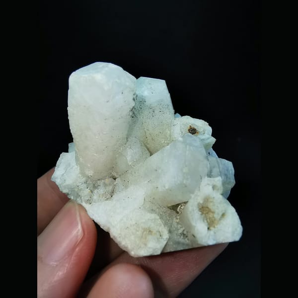 Columnar calcite cluster with etched tips — complete view