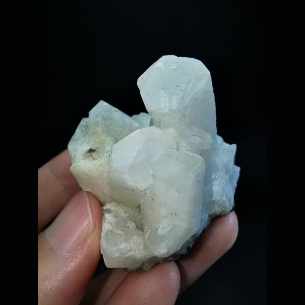 Columnar calcite cluster with etched tips — detail view