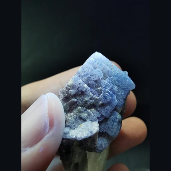 Purple-green fluorite with calcite plates — detail view