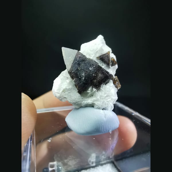 Helvine cluster half-wrapped in calcite — alternate view