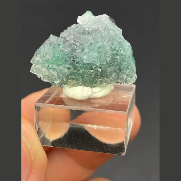 Twin icy quartz balls over malachite from the Congo — alternate view