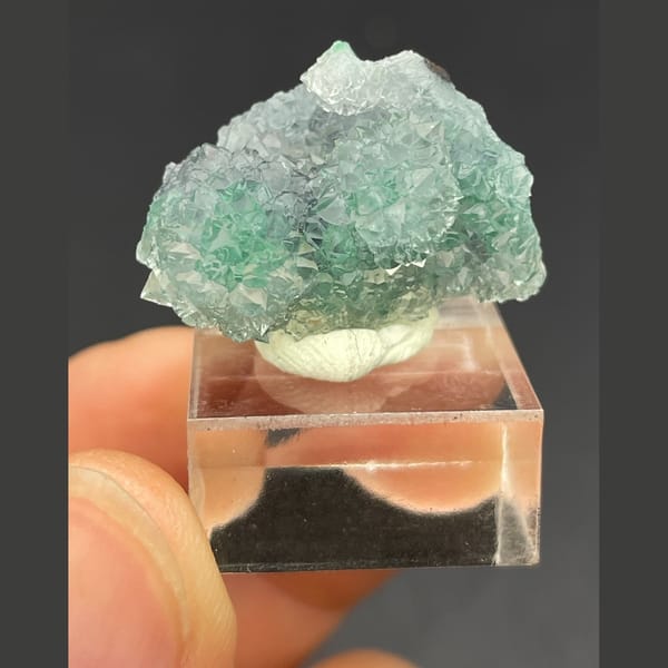 Twin icy quartz balls over malachite from the Congo — alternate view
