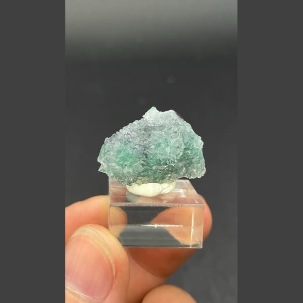 Twin icy quartz balls over malachite from the Congo — detail view