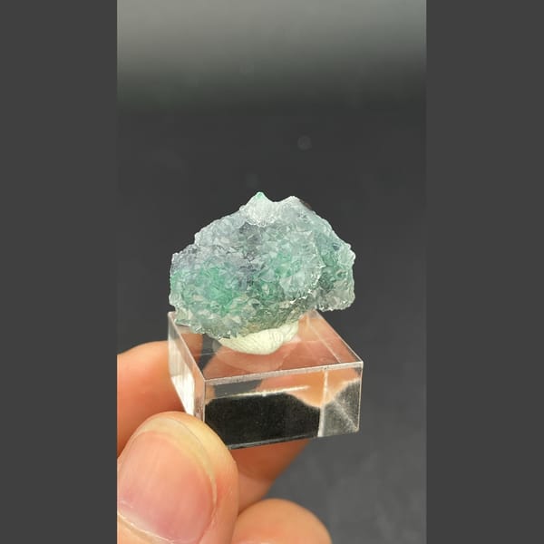 Twin icy quartz balls over malachite from the Congo — detail view