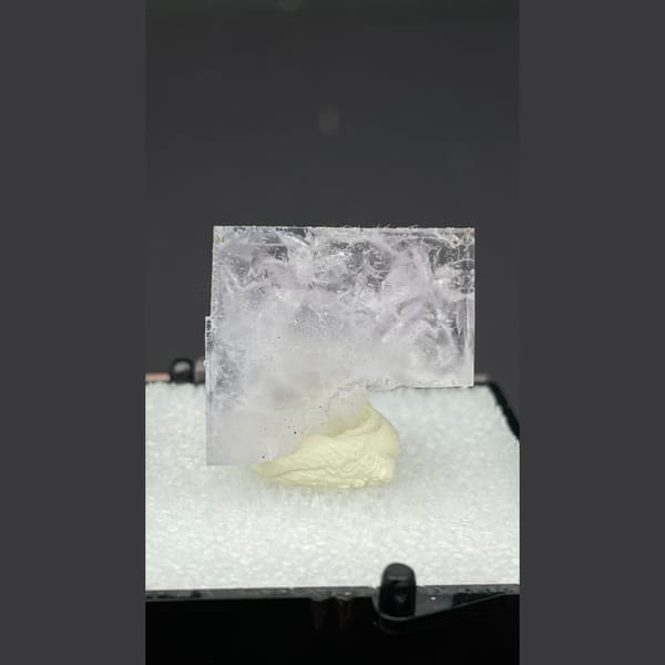 Clear glassy fluorite crystal with inner flower patterns from Zhejiang — complete view
