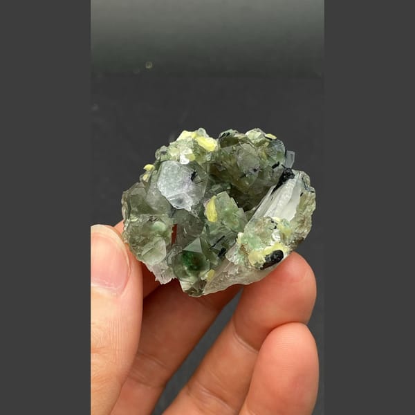 Pale green fluorite with quartz, black tourmaline and mica from Namibia — detail view