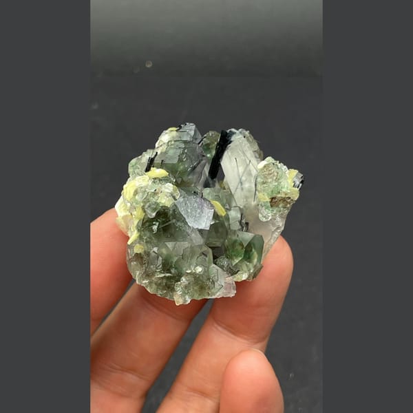 Pale green fluorite with quartz, black tourmaline and mica from Namibia — detail view