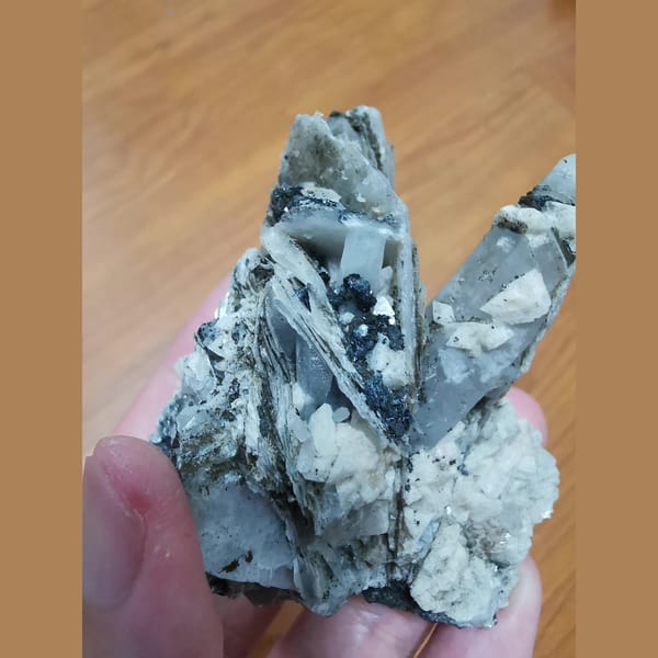 Interference quartz with dolomite, calcite and hematite — detail view