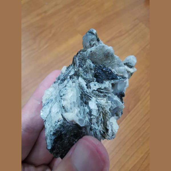Interference quartz with dolomite, calcite and hematite — detail view