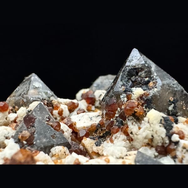 Smoky quartz, feldspar and spessartine garnet from Yunxiao, Fujian — detail view