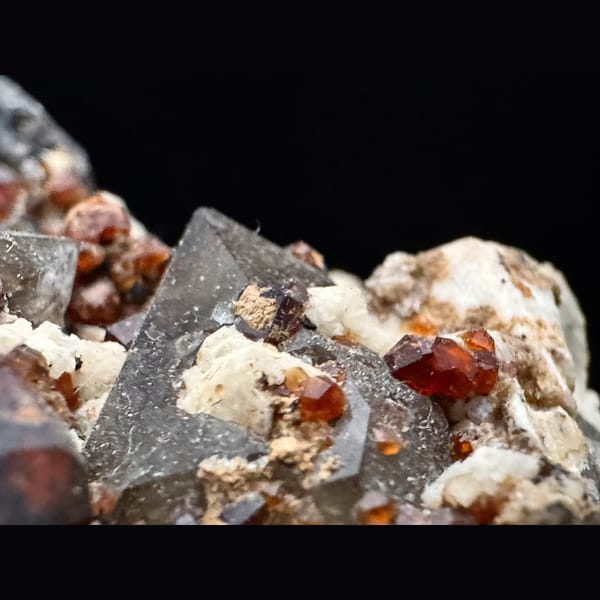 Smoky quartz, feldspar and spessartine garnet from Yunxiao, Fujian — detail view